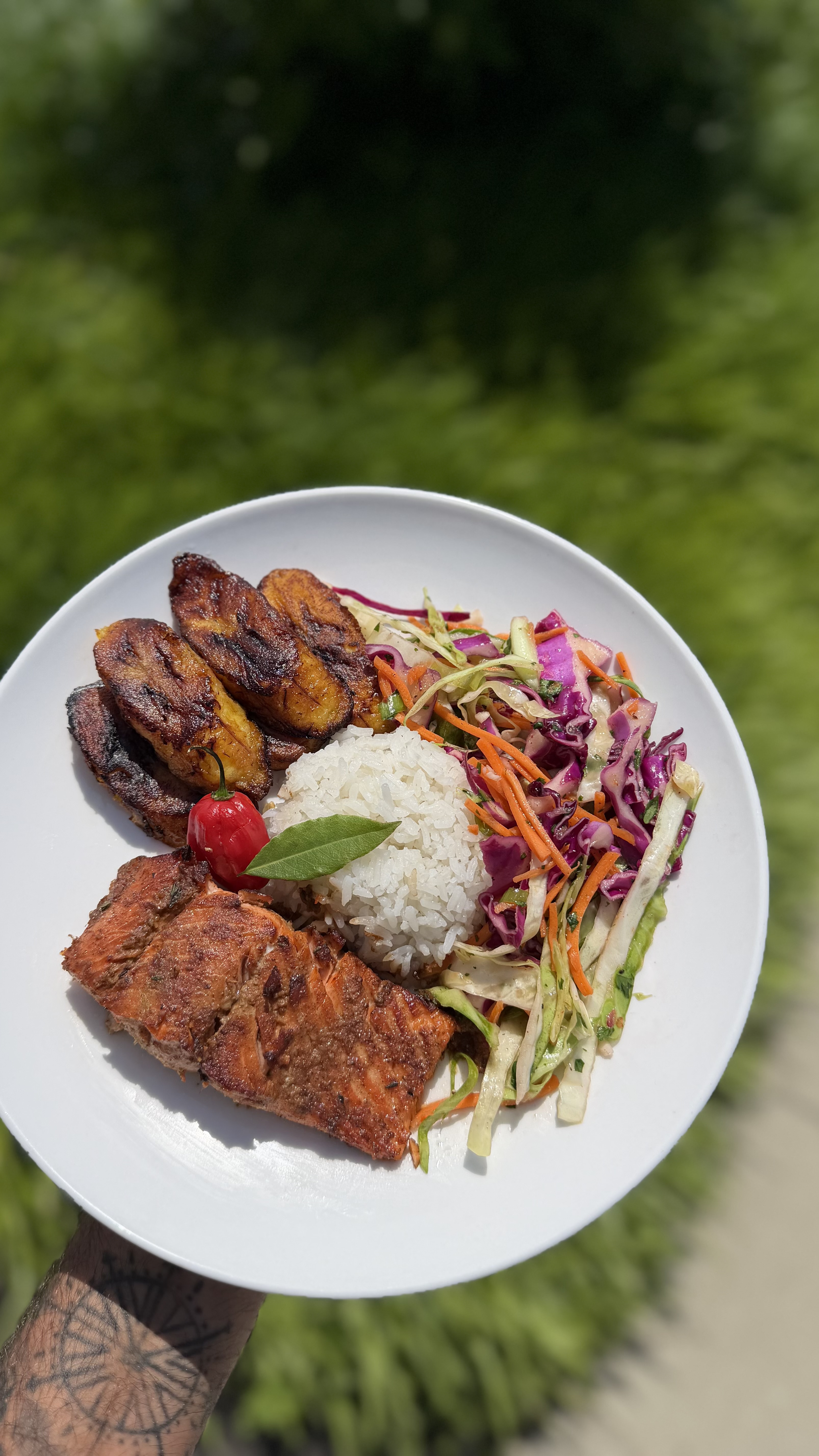 Caribbean Jerk Salmon with coconut jasmine rice, caramelized sweet plantains and slaw
